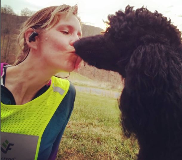 Dr. Emily Thomas kissing her pet